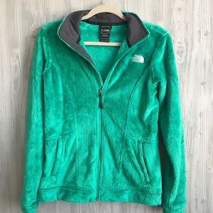 Green women’s fuzzy North Face.